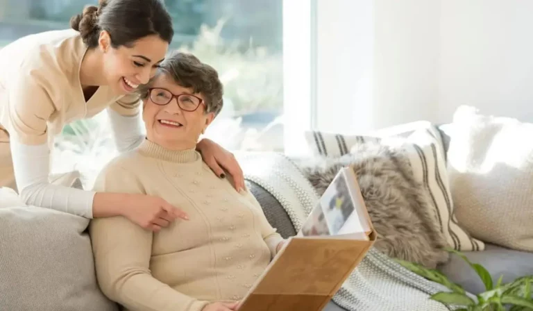 A woman Senior citizen getting help at Olimpia’s Senior Care Assisted Living facility staff